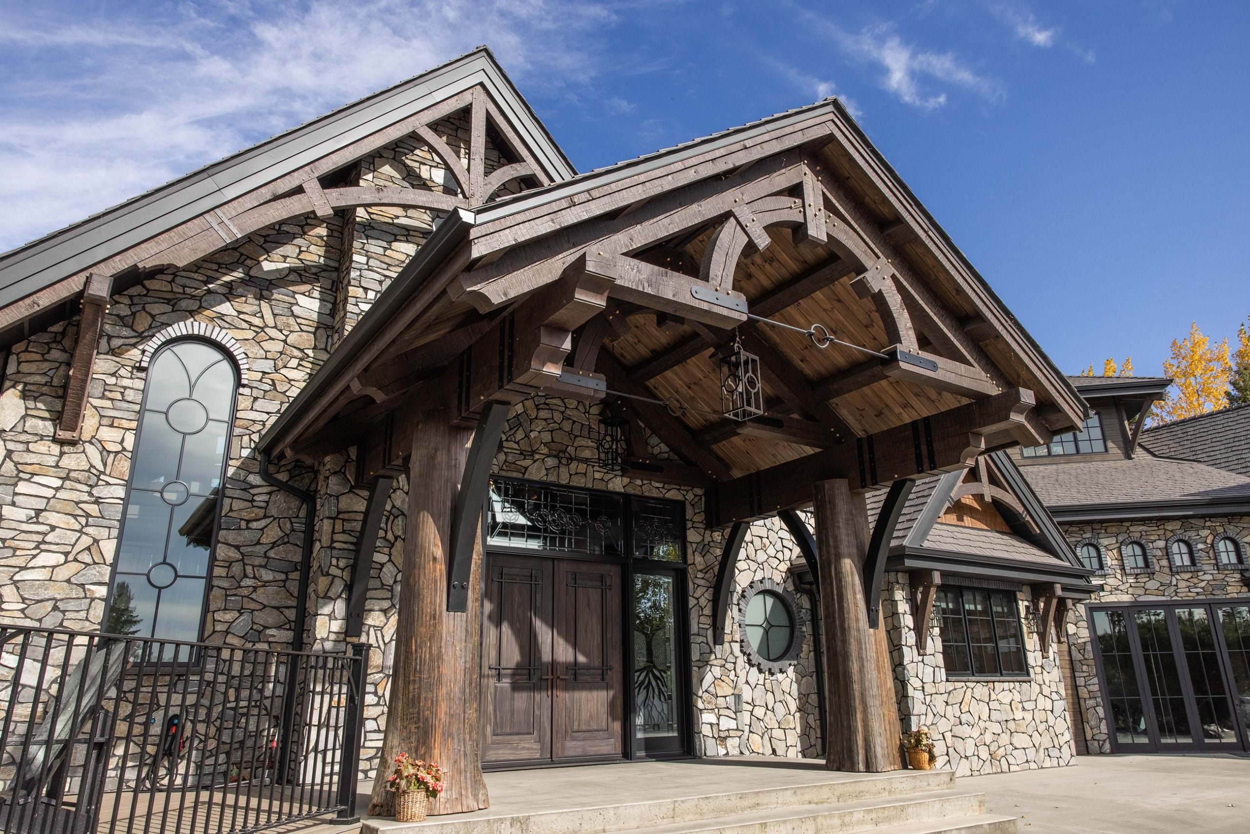 home exterior with stone and wood trim accents.