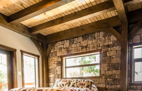 Bedroom with stone accent wall