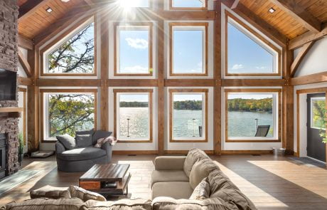 Living room wall of windows overlooking the lake