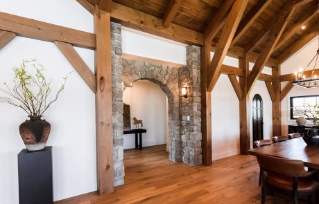 Stone arched accent wall leading to hallway