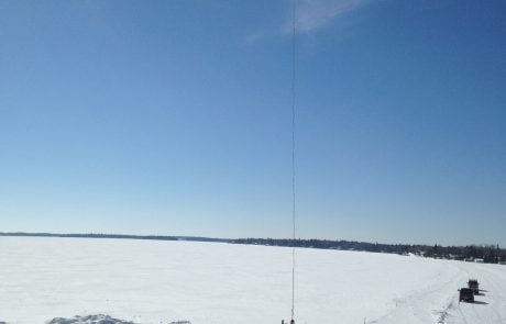 Helicopter bringing in trusses for home build