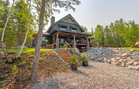Home exterior view with stairs leading up to the desk.