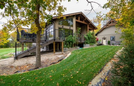 Home exterior side view of staircase leading up to the deck