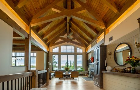 View into living room with large windows showing the lake view.