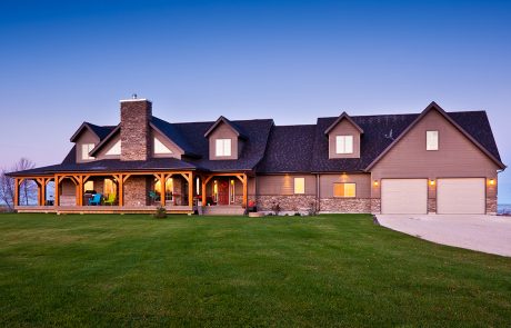 Home exterior with front porch and two car garage