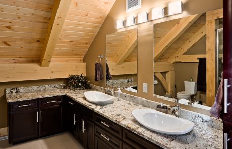 Bathroom with dark wood vanity and double sinks