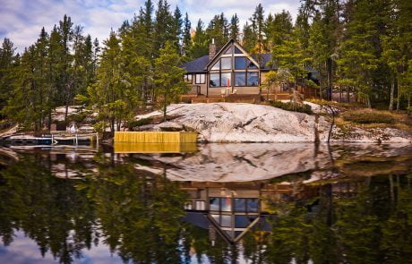 Home exterior with reflection on the lake